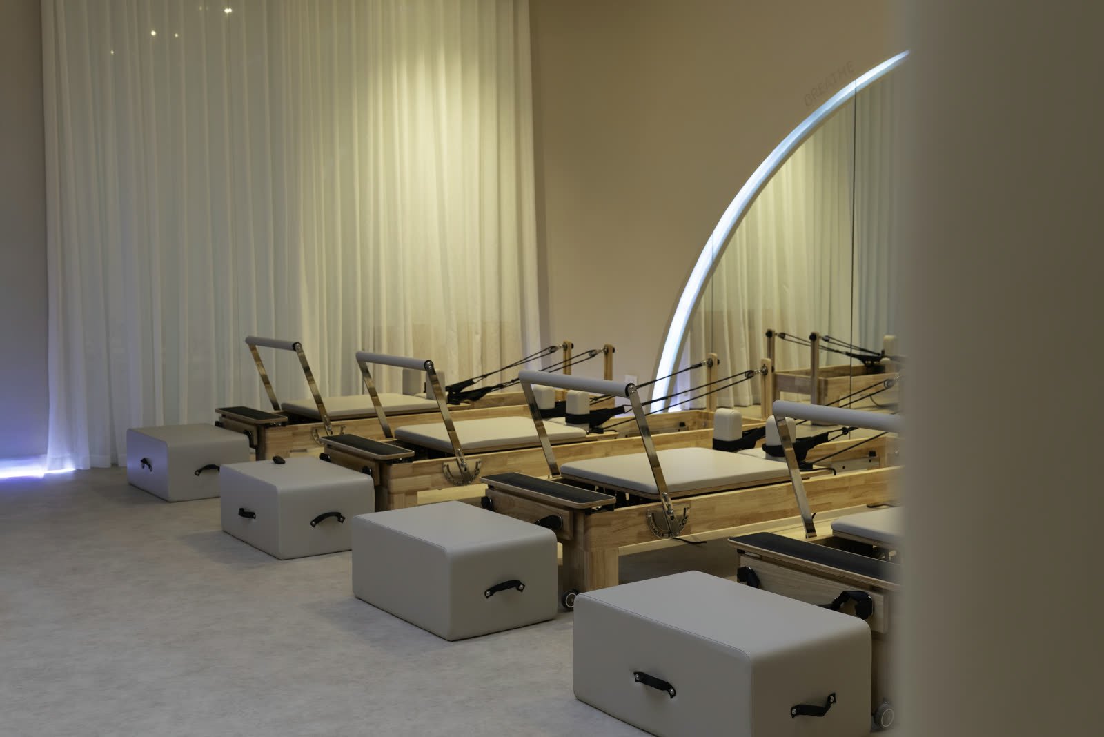 Reformer Pilates studio floor at Studio 8 seen from the entrance, New Cairo